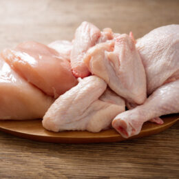 fresh chicken meat on a wooden board